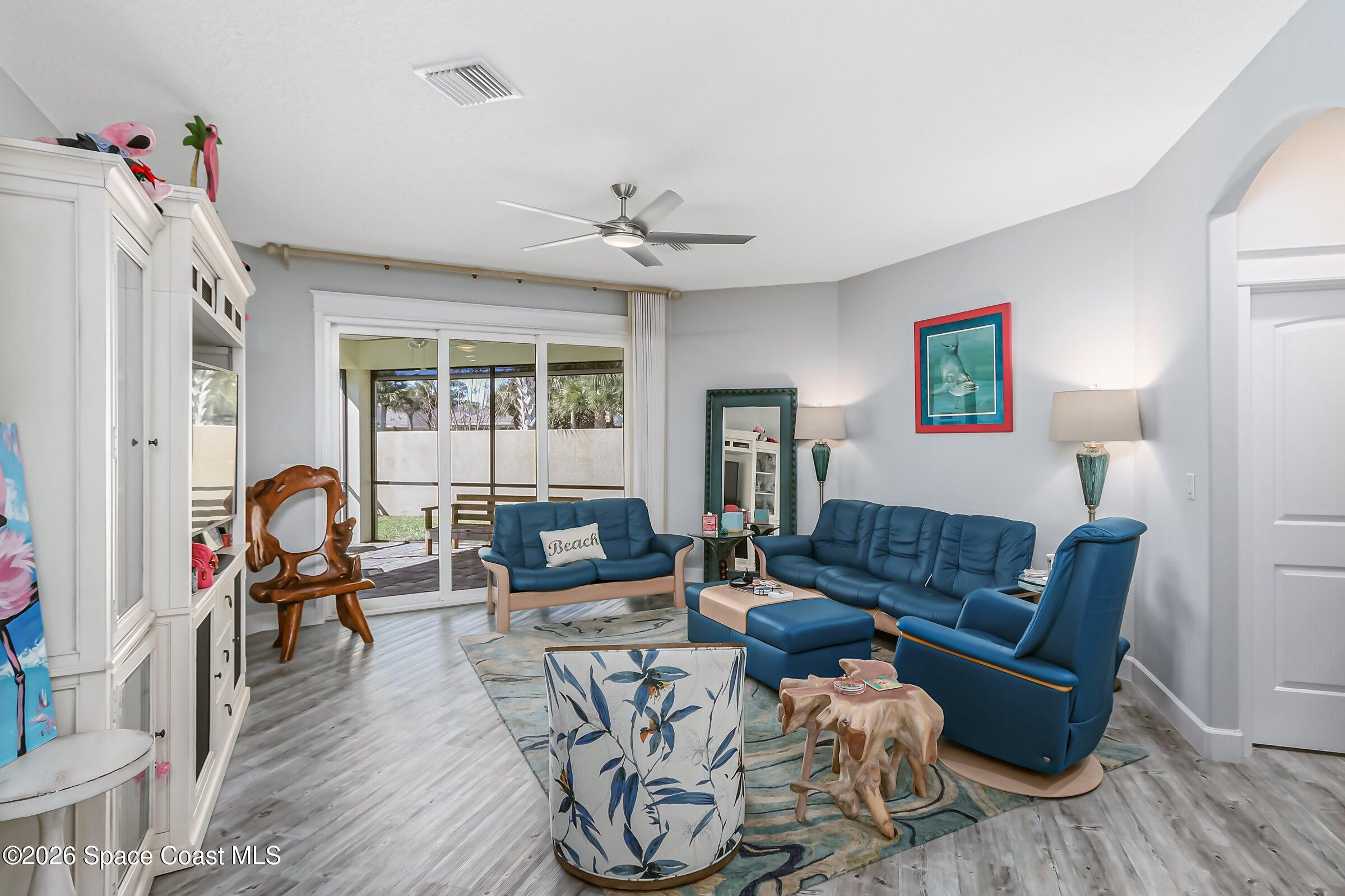 1399 Tullagee Avenue Melbourne, FL 32940 - Photo 8 of 53 a living room with furniture and a window