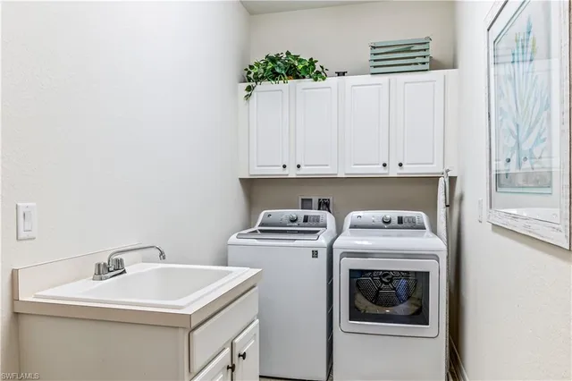 a view of a hallway with entryway wooden floor and front door