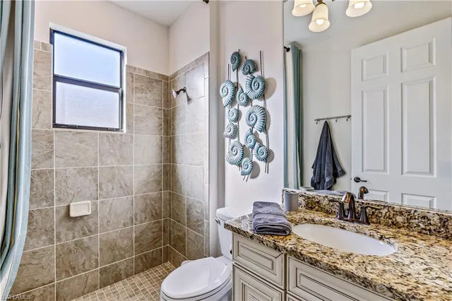 a living room with kitchen island furniture and a chandelier