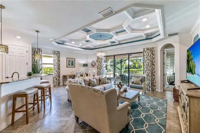a large white kitchen with a large window