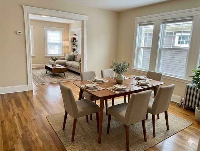 25 Glendower Road, Unit 2 Boston, MA 02131 - Photo 4 of 17 a view of a dining room with furniture and wooden floor