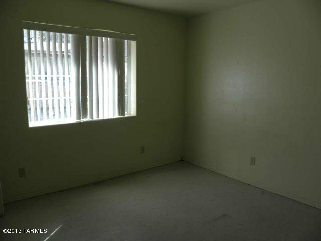 1241 Calle Pico Rio Rico, AZ 85648 - Photo 7 of 9 an empty room with a window