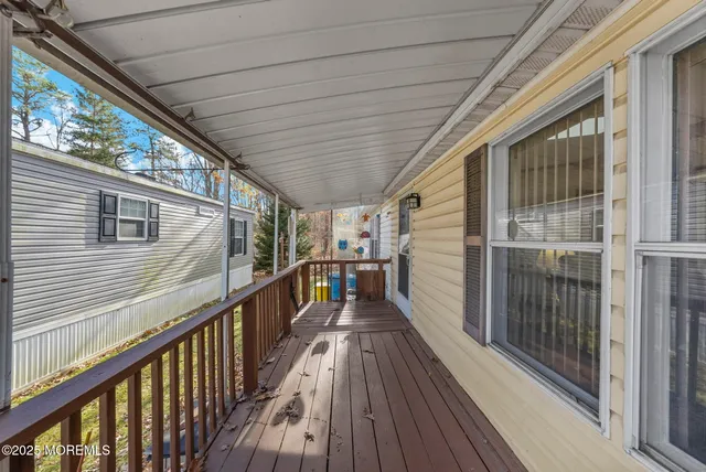 a view of a balcony with wooden floor