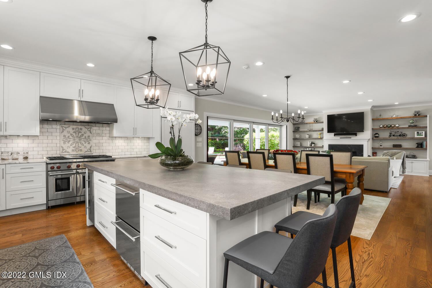 2 Loch Lane Greenwich, CT 06830 - Photo 14 of 64 a large kitchen with kitchen island a large island in it