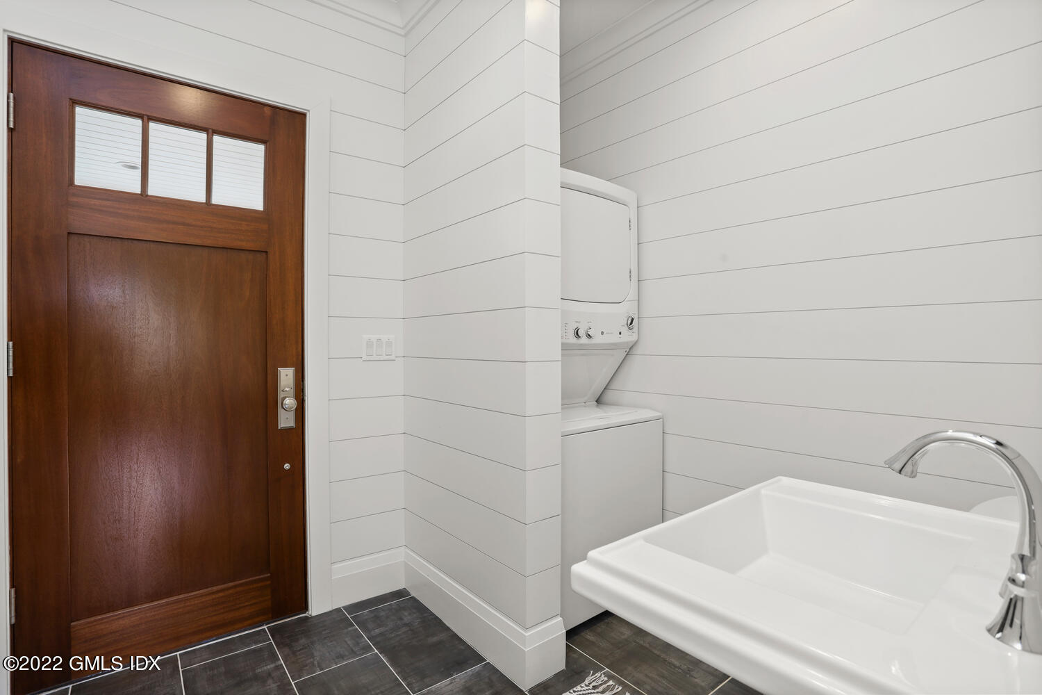 2 Loch Lane Greenwich, CT 06830 - Photo 25 of 64 a bathroom with a sink and shower
