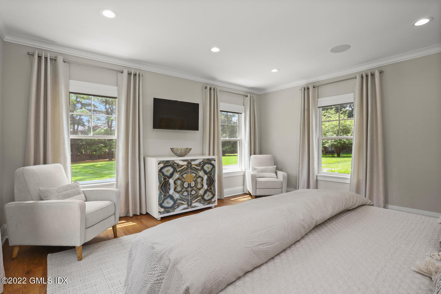 2 Loch Lane Greenwich, CT 06830 - Photo 28 of 64 a spacious bedroom with a bed and glass window