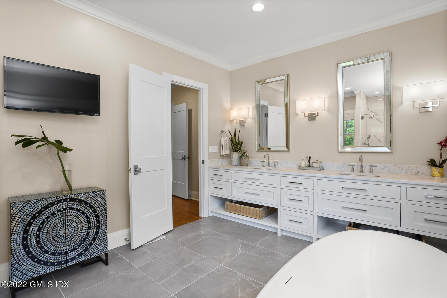 2 Loch Lane Greenwich, CT 06830 - Photo 30 of 64 a bathroom with a double vanity sink a mirror and a shower