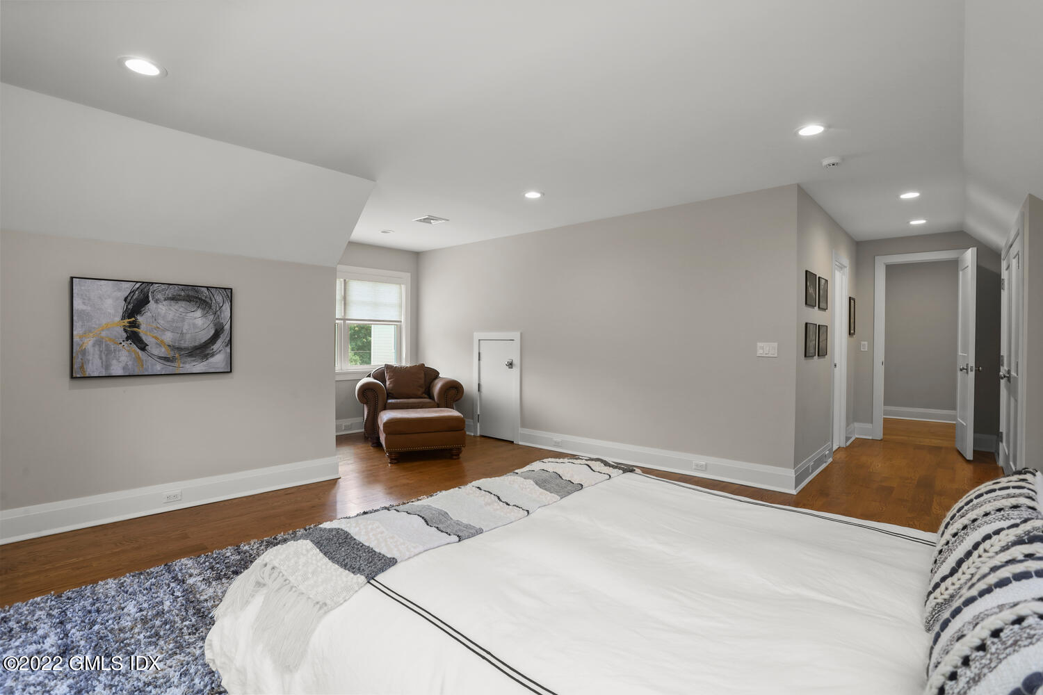 2 Loch Lane Greenwich, CT 06830 - Photo 42 of 64 a bedroom with a bed and a couch