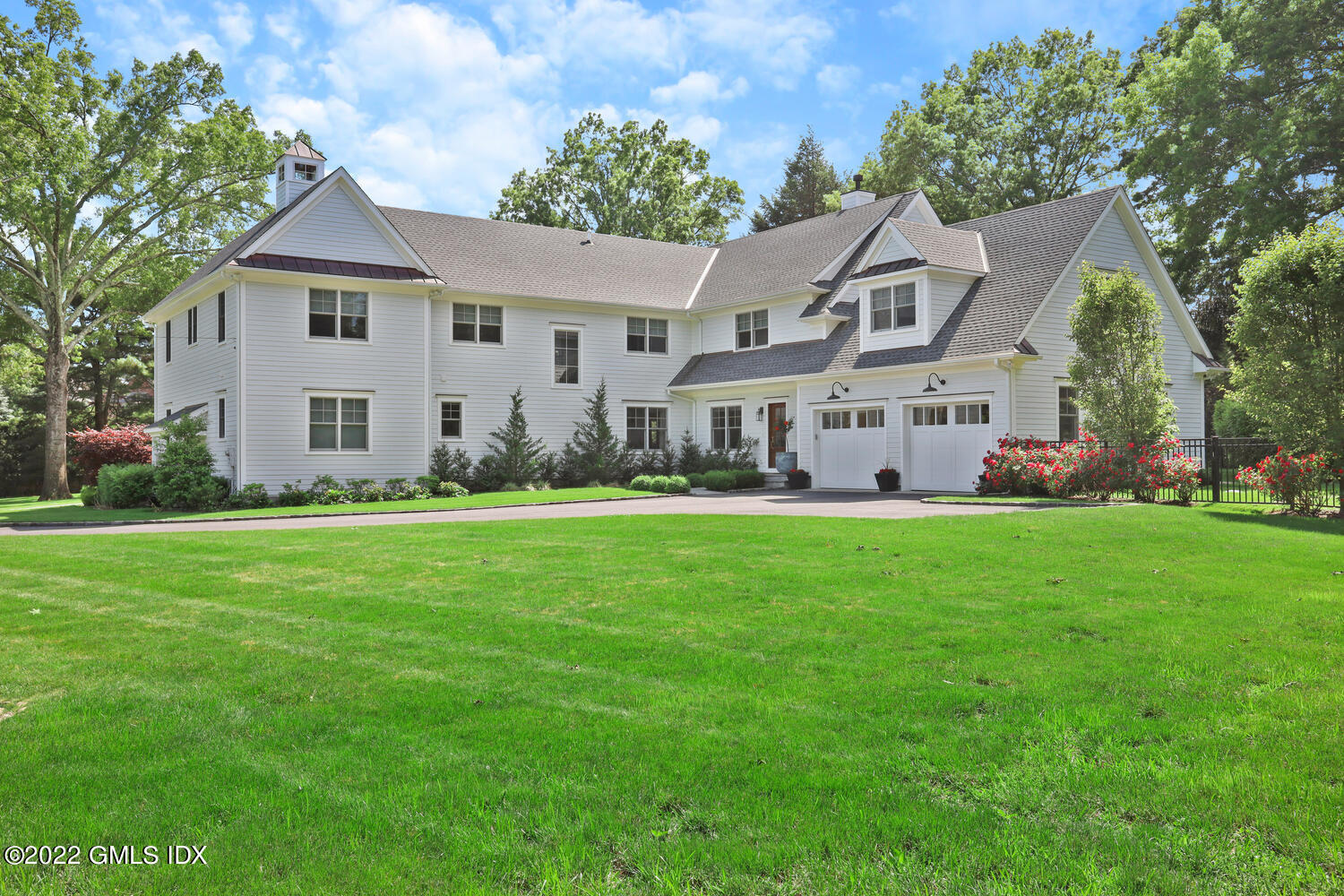 2 Loch Lane Greenwich, CT 06830 - Photo 59 of 64 a front view of a house with garden