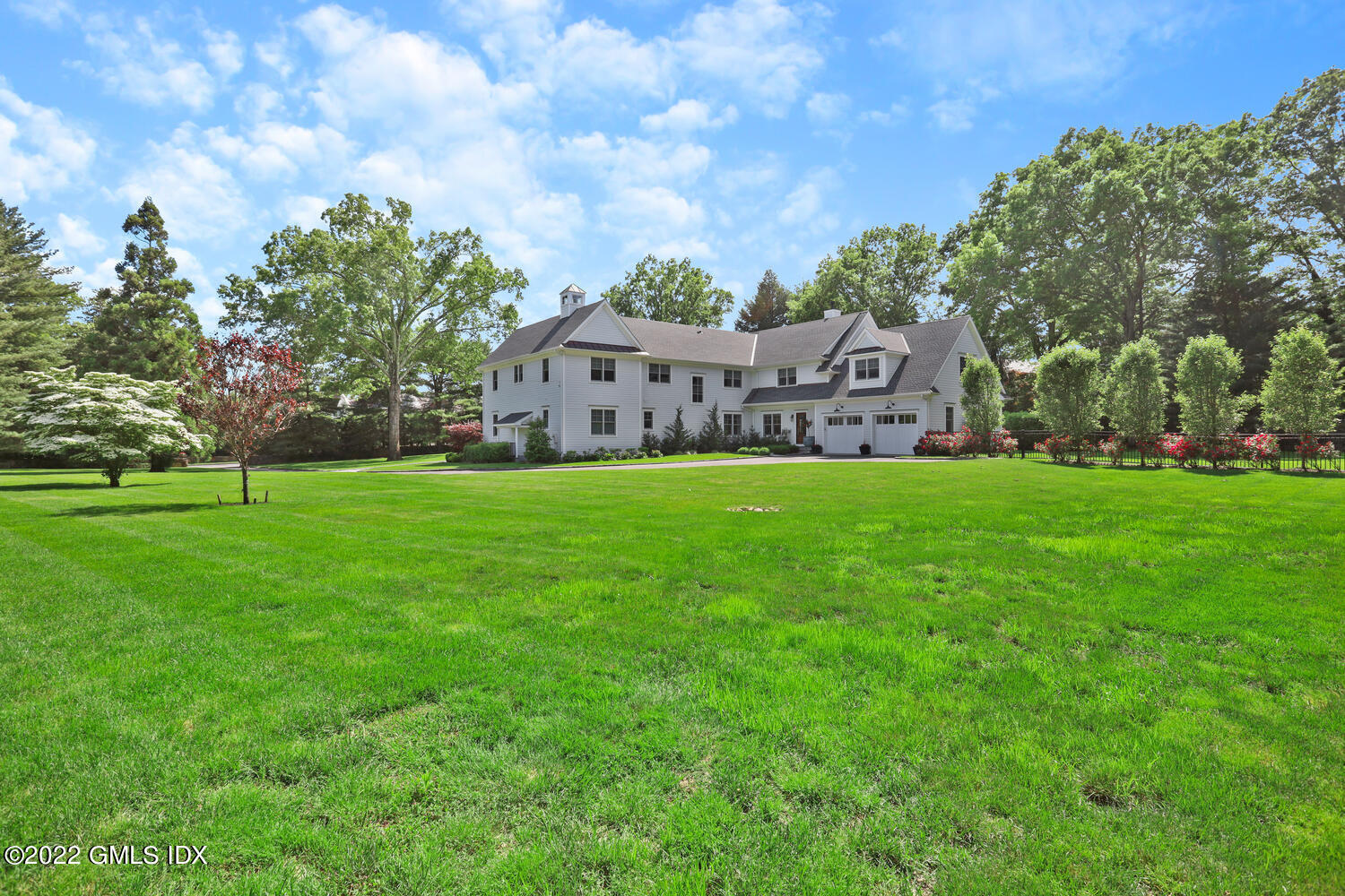 2 Loch Lane Greenwich, CT 06830 - Photo 60 of 64 a view of a house with a big yard and large trees