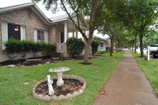 a patio with a yard table and chairs