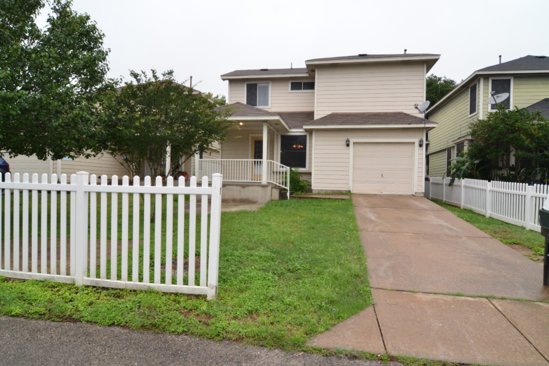 316 Strawn Kyle, TX 78640 - Photo 32 of 34 a front view of a house with a garden and porch