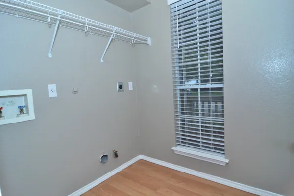 a view of a room with stairs and a window