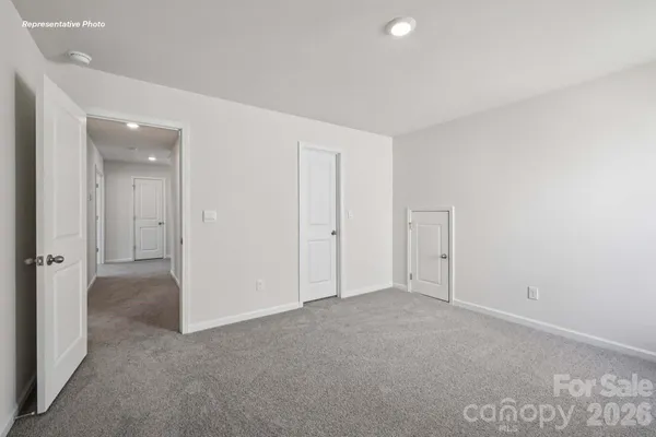 an empty room with closet area