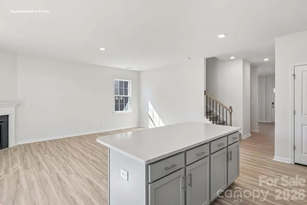 a kitchen with a sink and a refrigerator