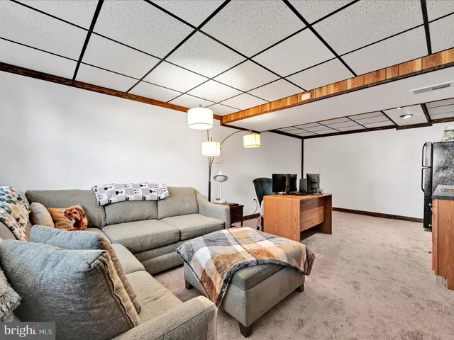a living room with furniture and a table