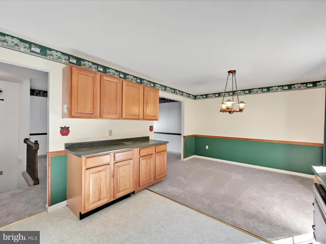 a kitchen with granite countertop a sink and a cabinets