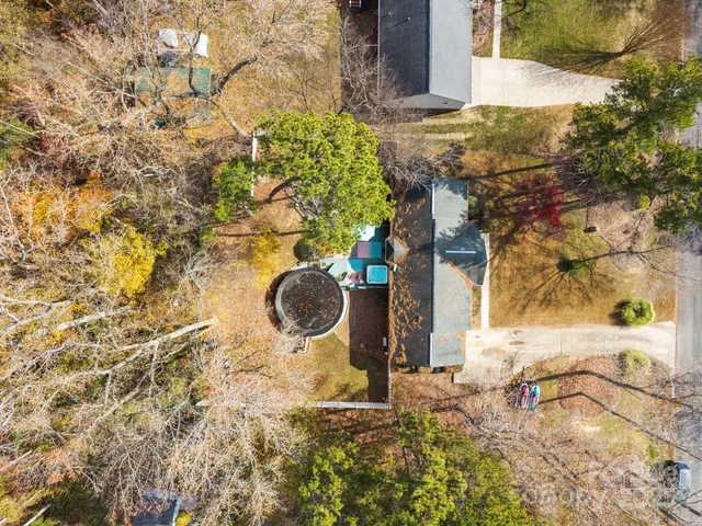 a view of a city with lush green forest
