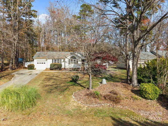 a view of a town with large trees