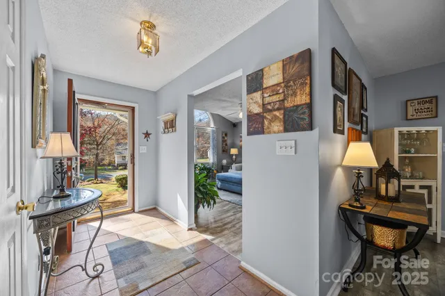 a view of a livingroom with furniture and a window