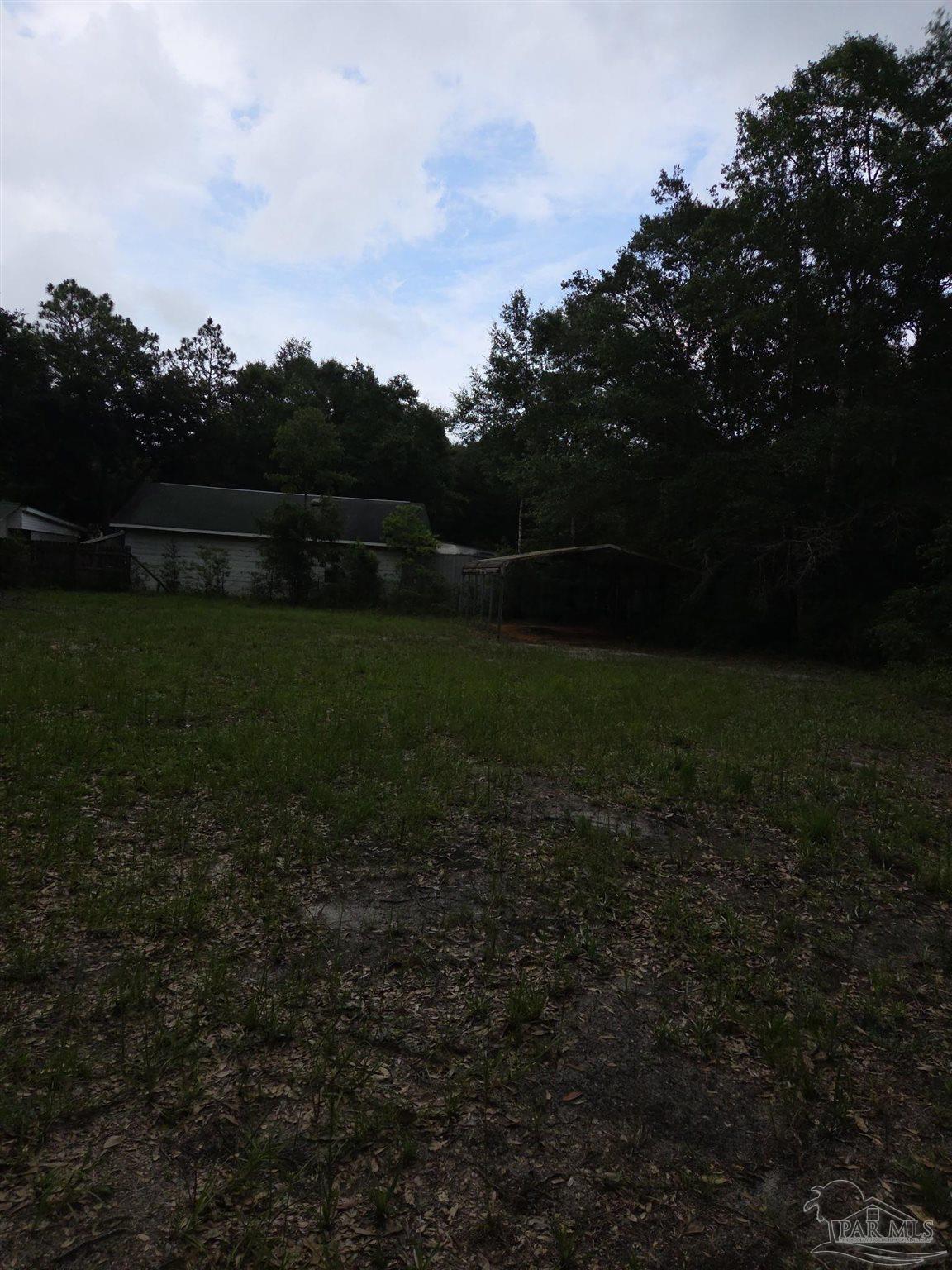 7991 Old Hickory Hammock Road Milton, FL 32583 - Photo 1 of 42 a view of outdoor space and yard