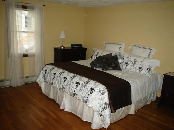 7 Lansdowne Road Arlington, MA 02474 - Photo 22 of 24 a bedroom with double bed and a window