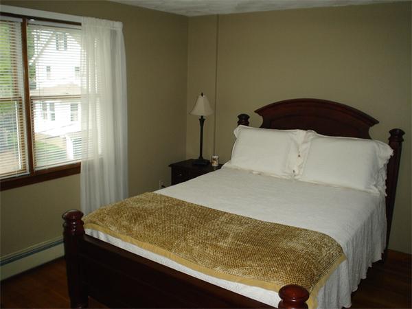 7 Lansdowne Road Arlington, MA 02474 - Photo 23 of 24 a bedroom with a bed and a window