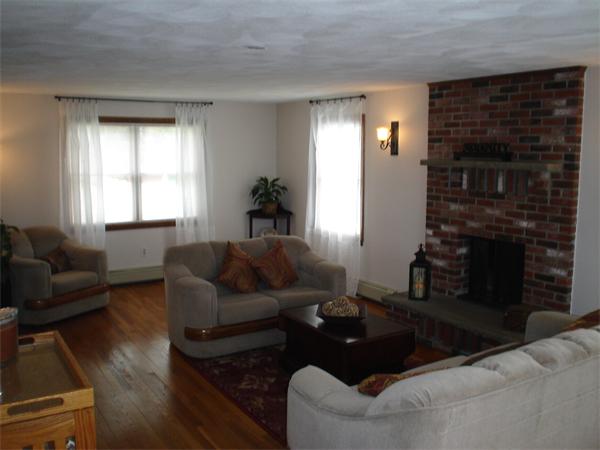 7 Lansdowne Road Arlington, MA 02474 - Photo 7 of 24 a living room with furniture and a fireplace