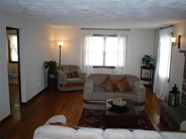 7 Lansdowne Road Arlington, MA 02474 - Photo 8 of 24 a living room with furniture and a large window