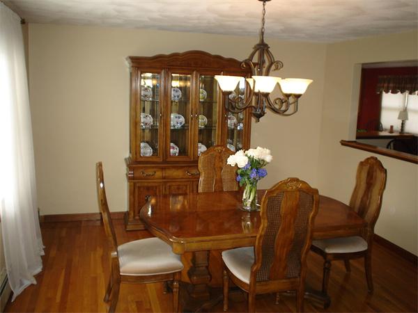 7 Lansdowne Road Arlington, MA 02474 - Photo 9 of 24 a dining room with furniture a chandelier and wooden floor
