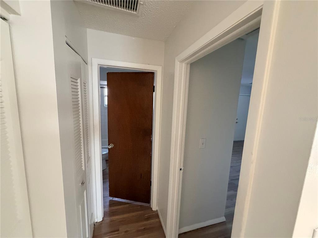 5604 Montana Avenue New Port Richey, FL 34652 - Photo 6 of 10 a view of a hallway with wooden floor