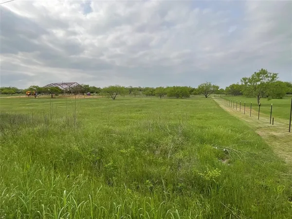 a view of lake with green space