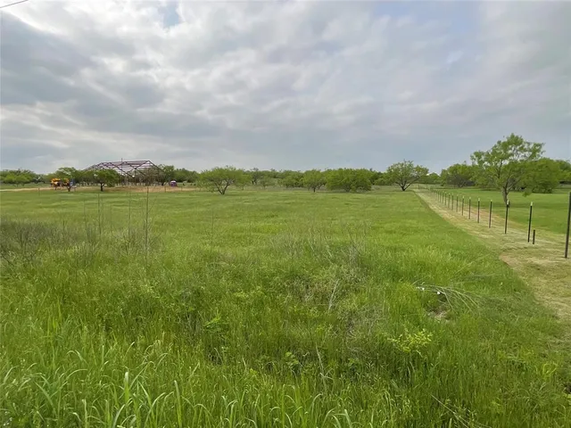 a view of lake with green space