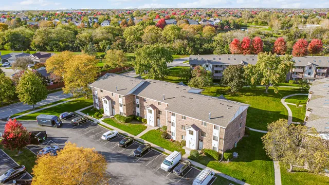 an aerial view of a house with a garden