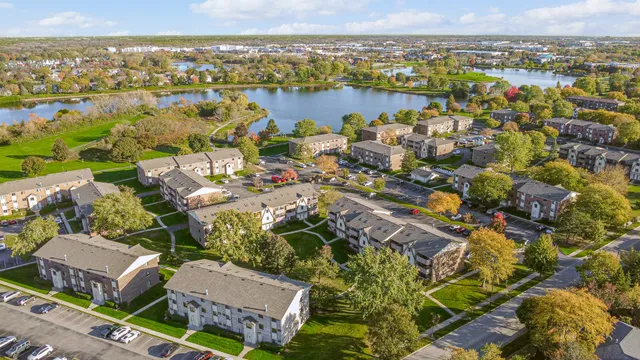an aerial view of residential building with outdoor space and ocean view