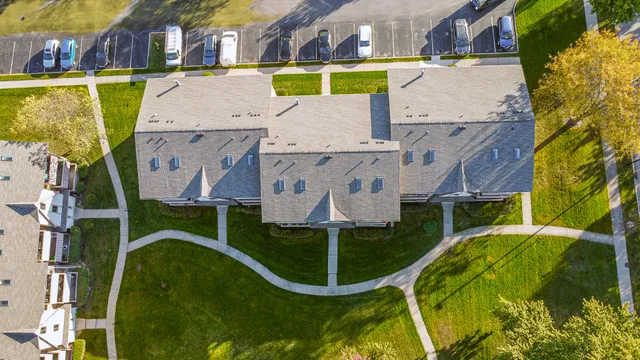 an aerial view of a house with swimming pool