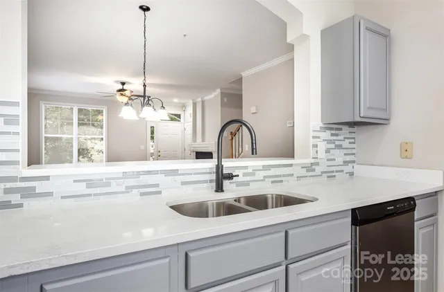 a kitchen with a sink and cabinets