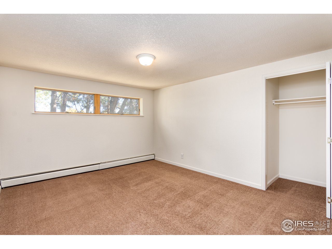 4579 Northeast County Line Road Erie, CO 80516 - Photo 15 of 38 a view of an empty room with a window