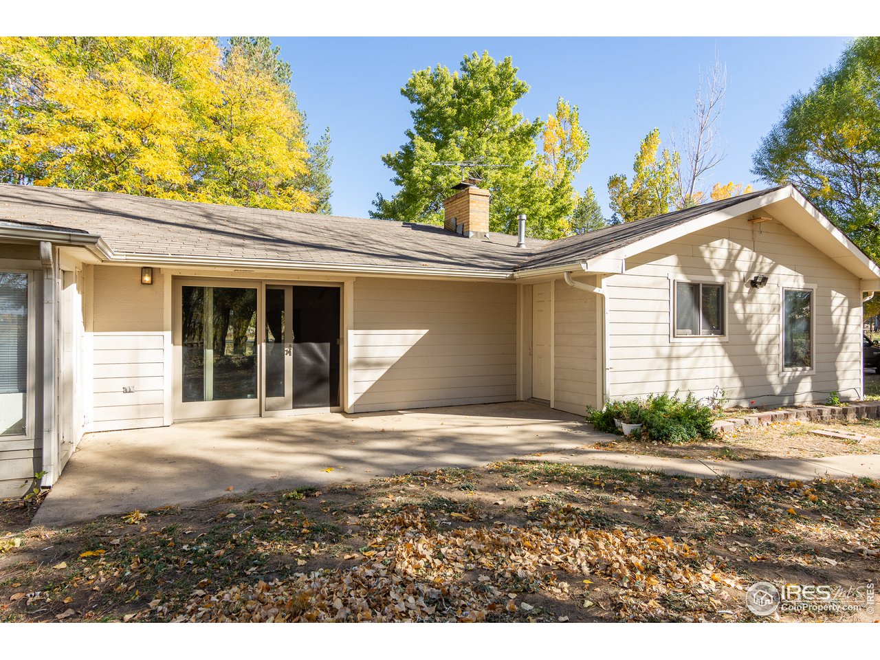 4579 Northeast County Line Road Erie, CO 80516 - Photo 19 of 38 a front view of a house with a yard