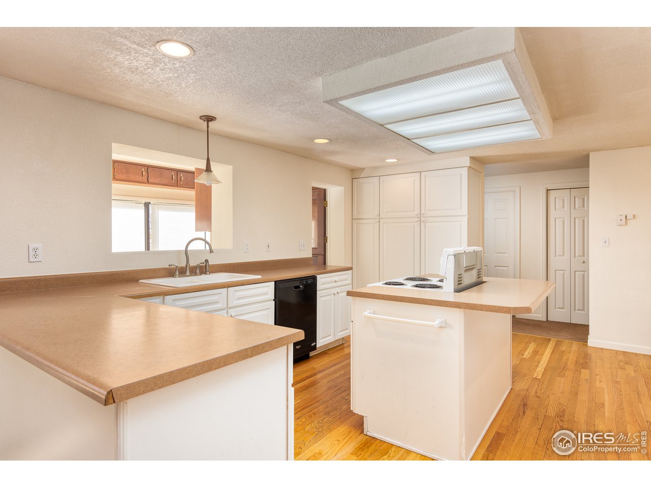 4579 Northeast County Line Road Erie, CO 80516 - Photo 5 of 38 a kitchen with stainless steel appliances granite countertop a sink a stove and a refrigerator