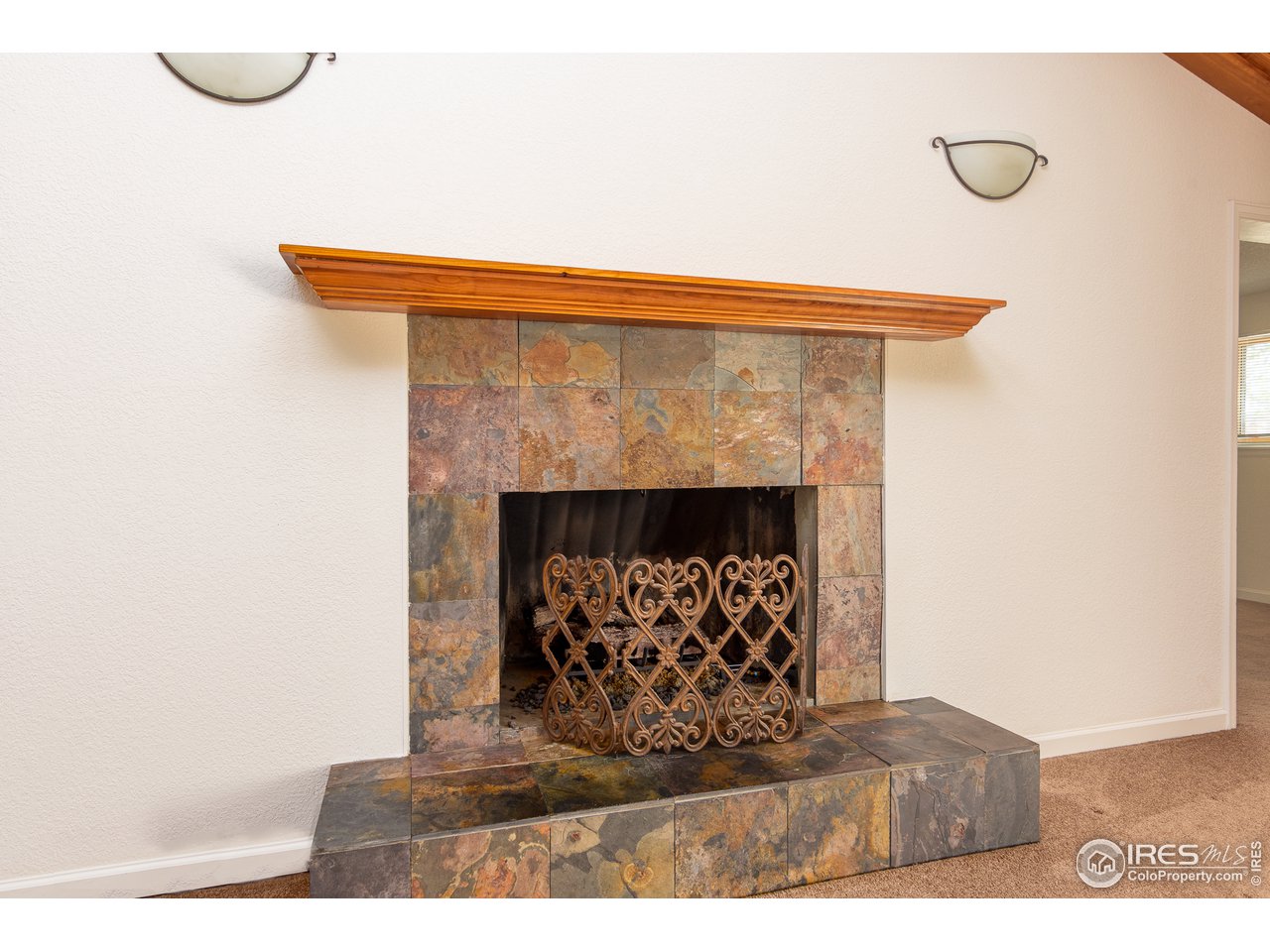 4579 Northeast County Line Road Erie, CO 80516 - Photo 10 of 38 a living room with a fireplace