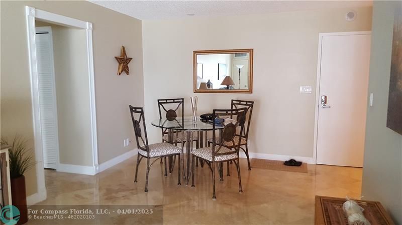 a view of a dining room with furniture