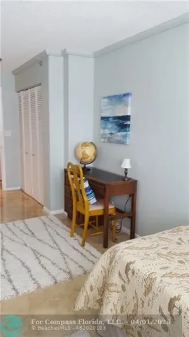 a bedroom with a bed and a table in it