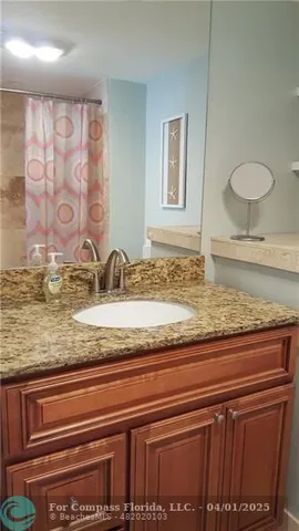 a view of a sink and mirror