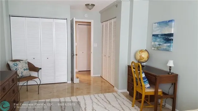 a view of a room with furniture and wooden floor