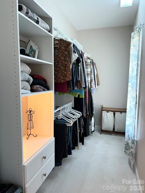 183 Burl Bridges Road Forest City, NC 28043 - Photo 17 of 31 a view of walk in closet with clothes and shoes
