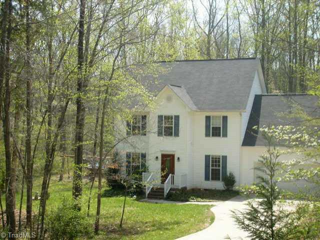 8115 Bartonshire Drive Oak Ridge, NC 27310 - Photo 1 of 9 Exterior Front. Home from Driveway