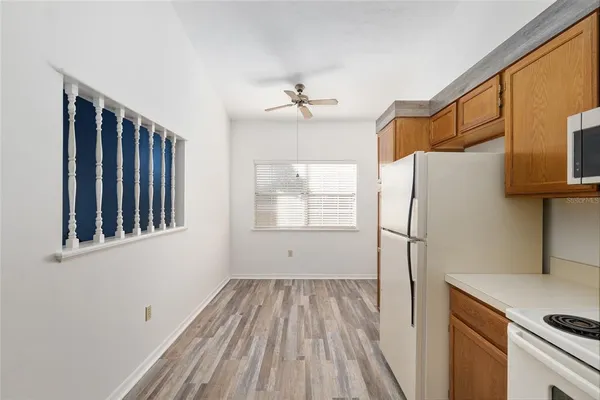a bathroom with a bathtub sink mirror and toilet
