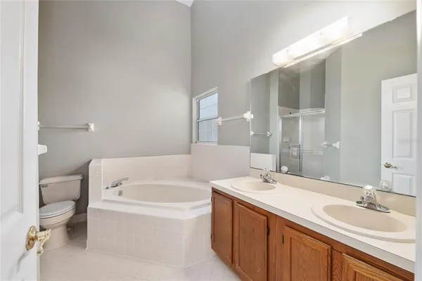 a bathroom with a toilet and shower