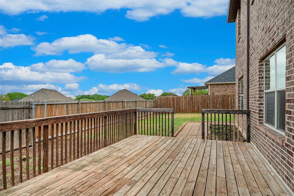 2322 Trace Ridge Drive Weatherford, TX 76087 - Photo 4 of 30 Wood deck with a fenced backyard
